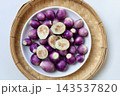 Fresh small purple eggplants arranged for cooking 143537820