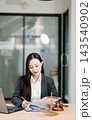 Beautiful asian woman lawyer working and gavel, tablet, laptop in front, Advice justice 143540902