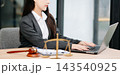 Justice and law concept.Male judge in a courtroom on white table and Counselor or Female lawyer working 143540925