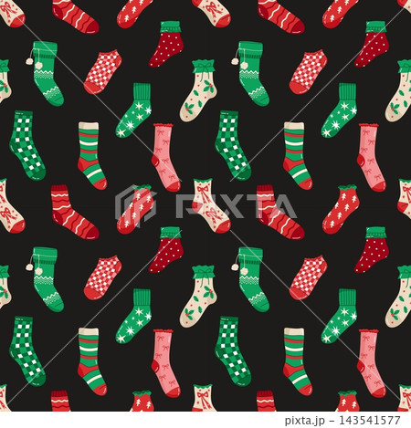 Seamless pattern with a variety of colorful Christmas stockings and socks on a black background 143541577