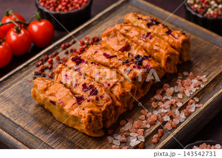 Stuffed cabbage rolls with rice and chicken or pork, seasoned with salt and spices with tomato sauce Stuffed cabbage rolls with rice and chicken or pork, seasoned with salt and spices with tomato sauce 143542731