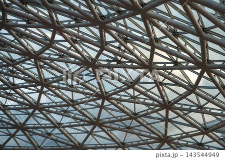 Intricate Glass and Steel Dome Architecture With Geometric Lattice Structure Over Indoor Atrium Space Intricate Glass and Steel Dome Architecture With Geometric Lattice Structure Over Indoor Atrium Space 143544949