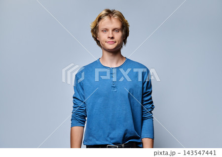 Smiling young blond man looking at camera in casual studio portrait shot 143547441