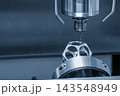 Metal parts cutting process on a CNC milling machine with a ball nose end mill tool in a light blue scene 143548949