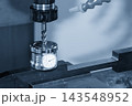 Tool length measurement process on a CNC milling machine using a tool presetter with a flat nose end mill in a blue tone scene 143548952
