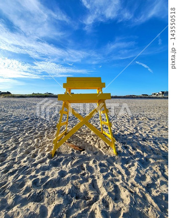 Yellow Chair on the Sand 143550518
