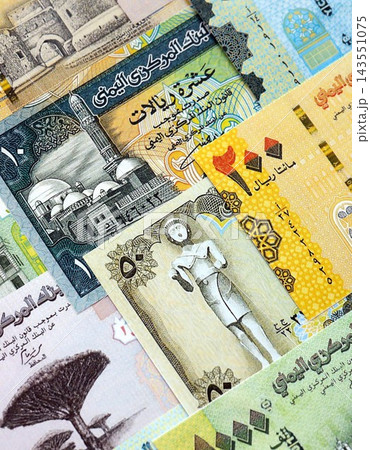 Yemeni rial paper banknotes pile on table. Yemen YER currency money bills in big amount. Concept of economics, taxation and banking in Yemen Yemeni rial paper banknotes pile on table. Yemen YER currency money bills in big amount. Concept of economics, taxation and banking in Yemen 143551075