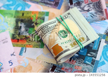 Kuwaiti dinar currency money bills and bunch of us dollar banknotes. Concept of currency exchange 143551256
