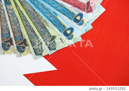 Bahraini dinar currency money bills lies on flag. The concept of business and investment Bahraini dinar currency money bills lies on flag. The concept of business and investment 143551282