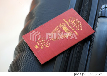 Bahraini passport on travel luggage. The concept of travel and vacation Bahraini passport on travel luggage. The concept of travel and vacation 143551288