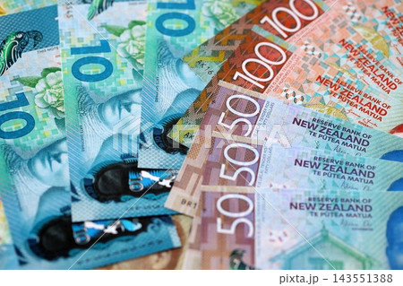 New Zealand dollar money bills in big amount on table close up. Rich life concept in New Zealand New Zealand dollar money bills in big amount on table close up. Rich life concept in New Zealand 143551388