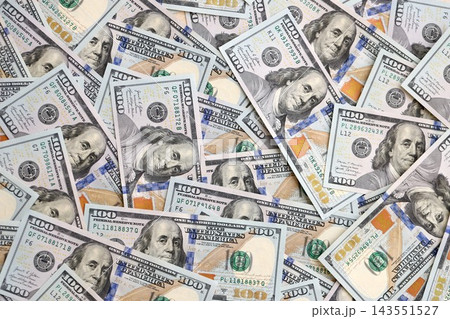 Stack of dollars and cash with a money background. US money and banknotes Stack of dollars and cash with a money background. US money and banknotes 143551527