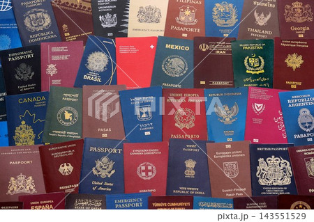 Big amount of passports of various different countries. Covers of expired passports close up Big amount of passports of various different countries. Covers of expired passports close up 143551529