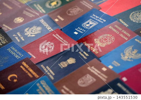 Big amount of passports of various different countries. Covers of expired passports close up 143551530
