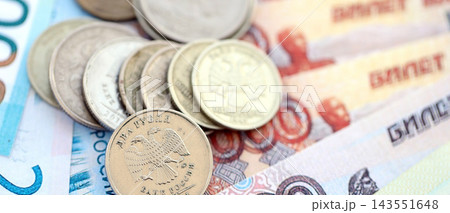 Coins and banknotes of Russian Federation ruble currency. Russia RUB money close up. Business Coins and banknotes of Russian Federation ruble currency. Russia RUB money close up. Business 143551648