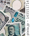 Japanese yen money bills pile on table. Japan banknotes of JPY currency close up 143551714