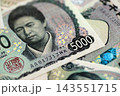 Japanese yen money bills pile on table. Japan banknotes of JPY currency close up 143551715