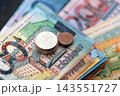 Belarusian ruble money bills and kopek coins pile. Belarus coins on banknotes of BYN currency 143551727