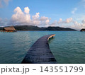 Wooden Jetty Extending Into Calm Tropical Sea 143551799