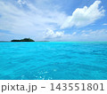 Turquoise Shallow Water and Tiny Islet Under Blue Sky 143551801