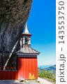 The historic wooden cliff chapel of Wildkirchli built into a mountain cave in the Alpstein region, Switzerland 143553750