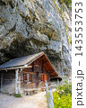 The historic wooden hermit house built into a mountain cave cliff in the Alpstein region, Appenzell, Switzerland 143553753