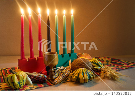 Kwanzaa kinara with seven burning mishumaa saba candles 143553813