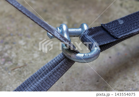 Metal shackle connecting tie-down straps for secure cargo restraint and transport safety Metal shackle connecting tie-down straps for secure cargo restraint and transport safety 143554075
