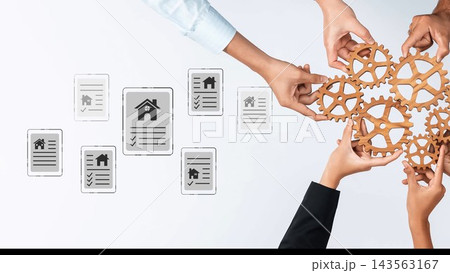 Collaborative Effort in Real Estate Management with Hands Holding Gears and Digital Documents on a Light Background Gluon Collaborative Effort in Real Estate Management with Hands Holding Gears and Digital Documents on a Light Background Gluon 143563167