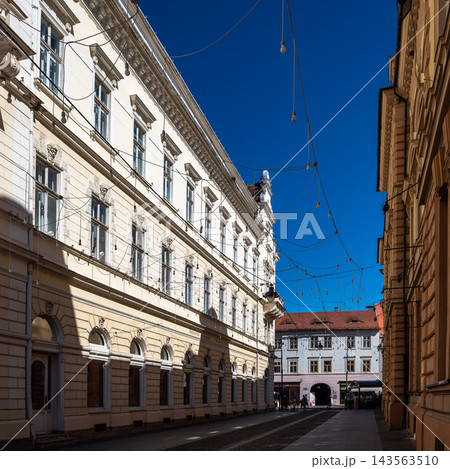 Narrow old town street with string lights and classic facades in Sibiu 143563510