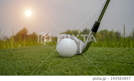 Golf club and ball in green grass. Golf club and ball in green grass. 143563957