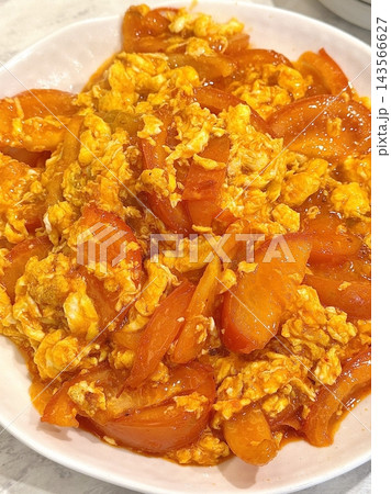 A simple dish of scrambled eggs with juicy tomatoes, seasoned lightly for a balance of flavor. Perfect as a quick and nutritious meal option. A simple dish of scrambled eggs with juicy tomatoes, seasoned lightly for a balance of flavor. Perfect as a quick and nutritious meal option. 143566627