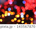 Colorful red and gold bokeh lights background for Christmas and New Year festival event 143567870