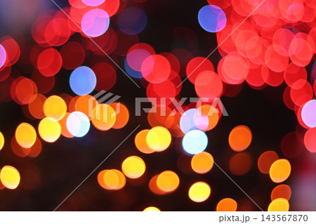 Colorful red and gold bokeh lights background for Christmas and New Year festival event 143567870
