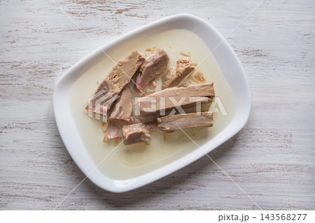 Canned Tuna Fish Chunks in Olive Oil on White Minimalist Plate 143568277