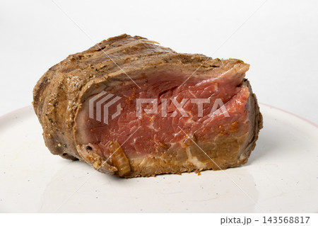 A Succulent Slice of Roast Beef Showcasing Juicy Meat and Rich Flavors, Perfect for a Hearty Meal or Gourmet Dish Presentation A Succulent Slice of Roast Beef Showcasing Juicy Meat and Rich Flavors, Perfect for a Hearty Meal or Gourmet Dish Presentation 143568817