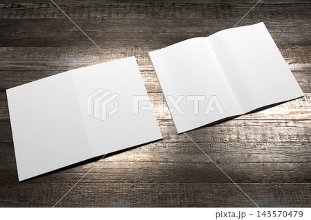 A4 to A5 brochure mockup with cover and content pages on wooden background A4 to A5 brochure mockup with cover and content pages on wooden background 143570479
