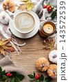 Autumn flat lay with coffee, candle, and pumpkins 143572539