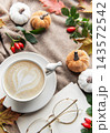 Autumn coziness with coffee, pumpkins, and fall leaves 143572542