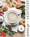 Autumn coffee latte with heart art and pumpkins 143572543