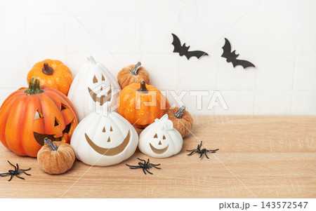 Halloween pumpkins with bats and spiders decoration 143572547