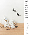 White ceramic pumpkins creating halloween festive decoration 143572548