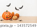 Halloween pumpkin jack o lantern with lit candles and spiders 143572549