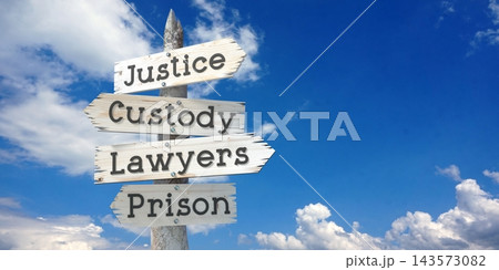 Justice, custody, lawyers, prison - wooden signpost with four arrows 143573082
