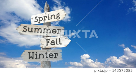 Spring, Summer, Fall, Winter - wooden signpost with four arrows Spring, Summer, Fall, Winter - wooden signpost with four arrows 143573083