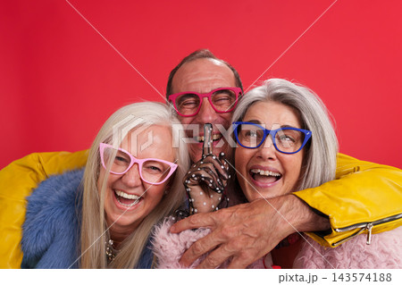 Vibrant mature friends celebrating joy and aging well Vibrant mature friends celebrating joy and aging well 143574188