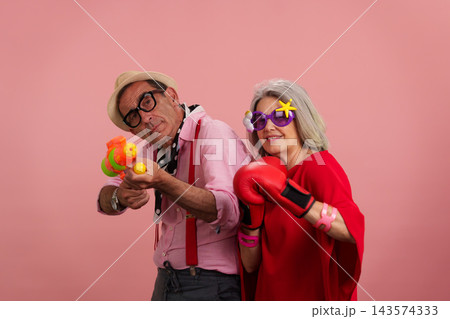 Senior couple sharing playful moment having fun together Senior couple sharing playful moment having fun together 143574333