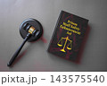Prison Staff Safety Enhancement Act dark law book with judge gavel on gray background, criminal justice concept 143575540