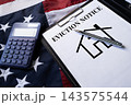 Eviction Notice document with calculator and house sketch on desk, real estate and tenant housing law concept 143575544