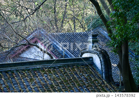 Close-up of the traditional, Chinese classic roof of Chinese building, Chinese architecture in China. Chinese and traditional style roof in China. Chinese historical building. Travel scene.  143578392
